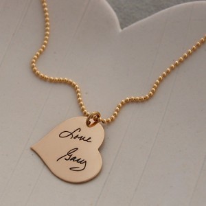 Handwriting on a heart charm