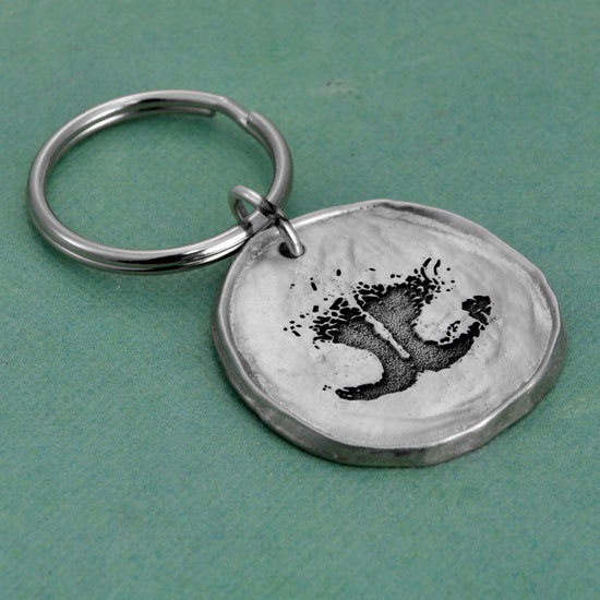 Dog nose print on a pewter key chain