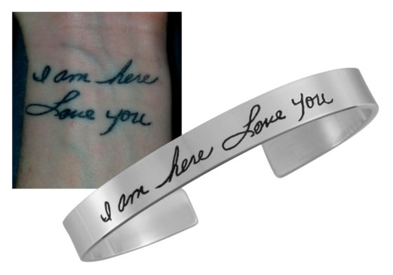 A tattoo on a wrist with handwriting, and a silver cuff created from that handwriting