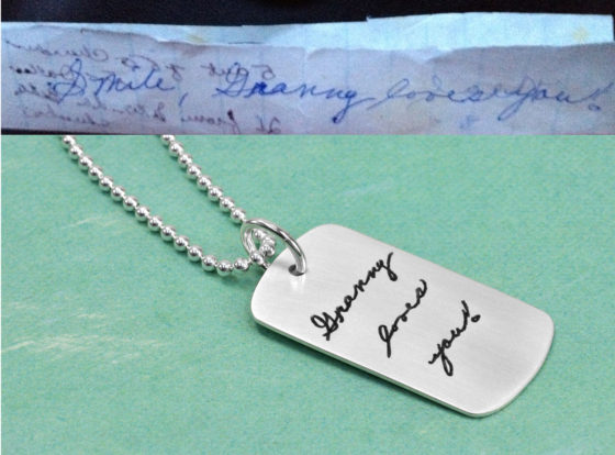 Silver dog tag with etched handwriting, and the original handwriting sample used to create the piece